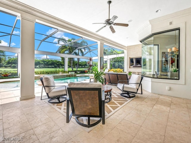 view of patio with a lanai, ceiling fan, and an outdoor pool