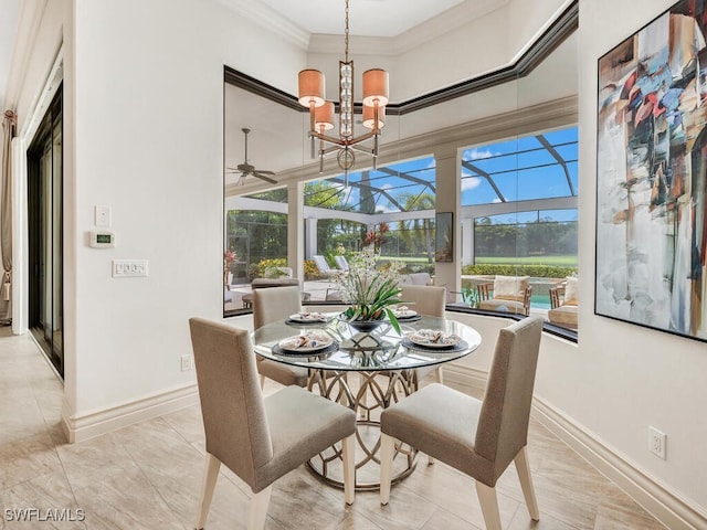 dining room featuring a high ceiling, ornamental molding, a ceiling fan, a sunroom, and baseboards