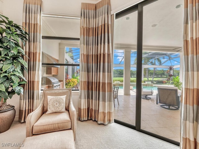 doorway featuring carpet floors and a sunroom