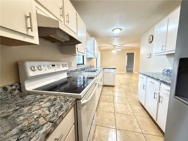 2807 E 8th St, Lehigh Acres, FL 33972 - kitchen featuring white appliances, a sink, ceiling fan, a textured ceiling, and white cabinets