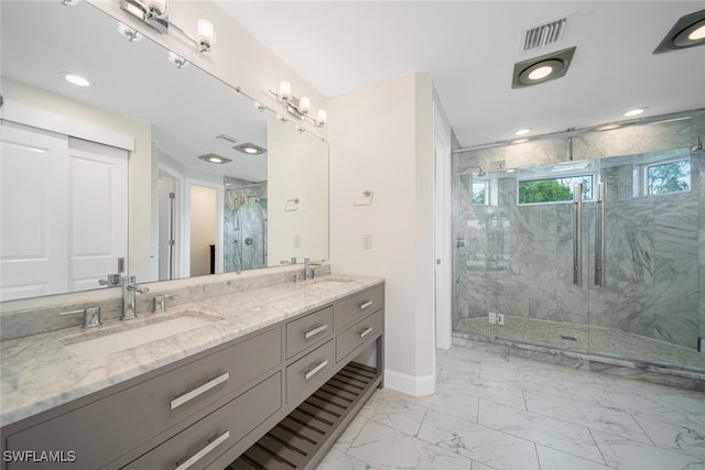 bathroom featuring an enclosed shower, dual bowl vanity, and tile patterned flooring