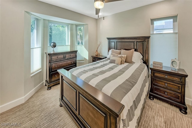 bedroom with light carpet and ceiling fan