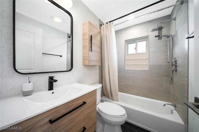 full bathroom featuring vanity, toilet, and shower / bath combination with curtain