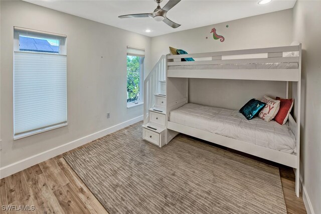 unfurnished bedroom with ceiling fan and light hardwood / wood-style floors