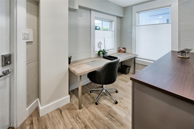 home office with light wood-type flooring