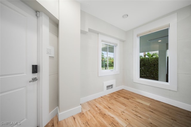 unfurnished room featuring light hardwood / wood-style floors