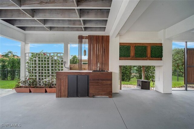 view of patio featuring fence