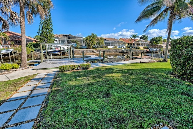 exterior space with a boat dock and a water view