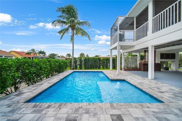 view of swimming pool with a patio and a fenced in pool