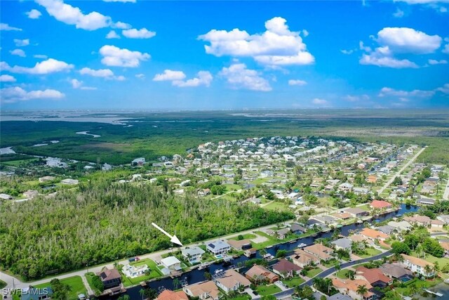 birds eye view of property with a residential view