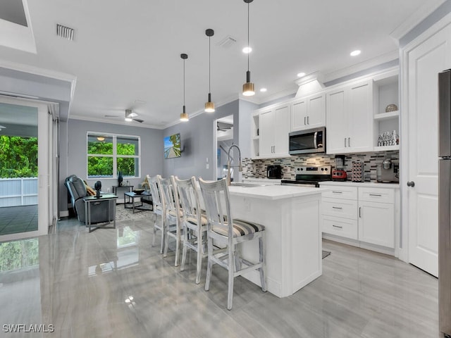 kitchen featuring visible vents, a sink, open shelves, and appliances with stainless steel finishes
