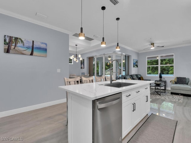 kitchen with a sink, white cabinetry, open floor plan, stainless steel dishwasher, and a center island with sink