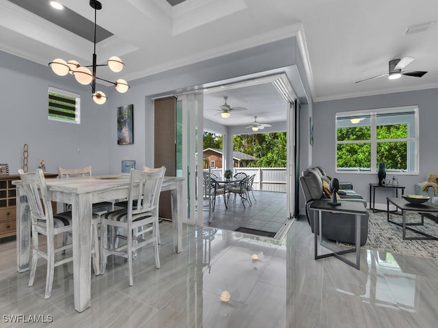 dining room featuring a notable chandelier, visible vents, and crown molding