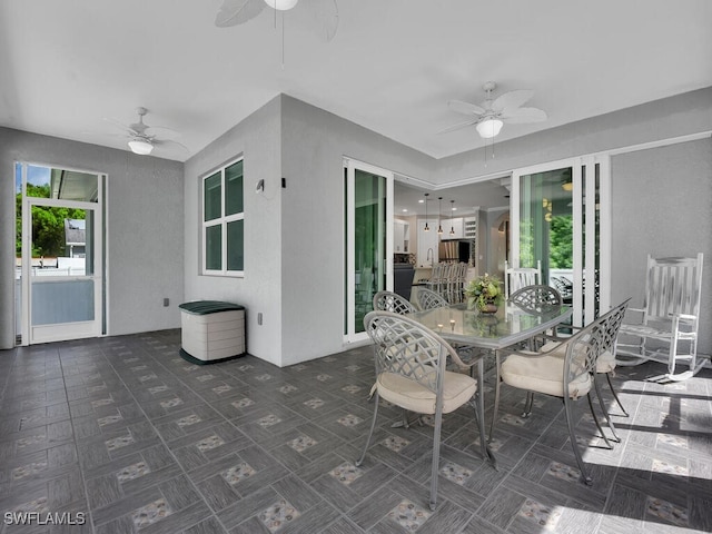 view of patio with ceiling fan and outdoor dining space