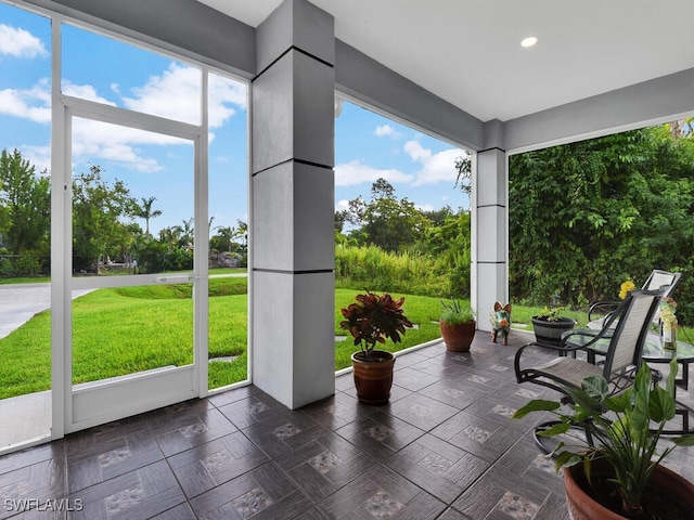 unfurnished sunroom with a wealth of natural light