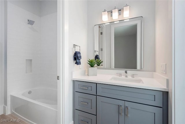 full bath featuring vanity and  shower combination