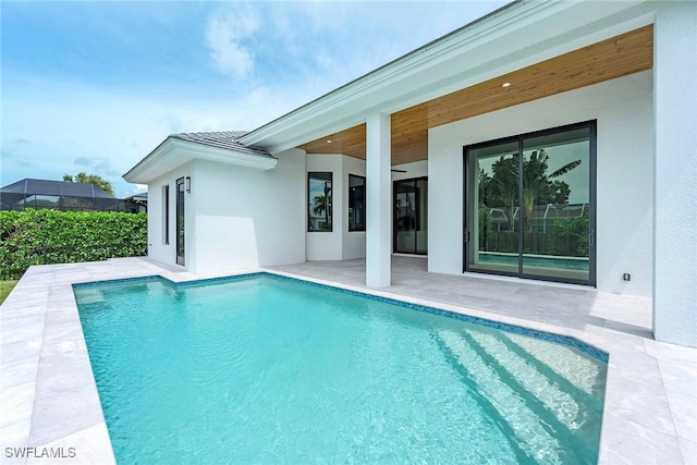 view of swimming pool with a patio and a fenced in pool