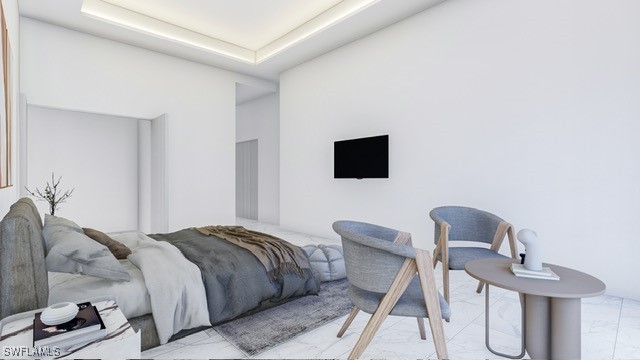 tiled bedroom featuring a tray ceiling