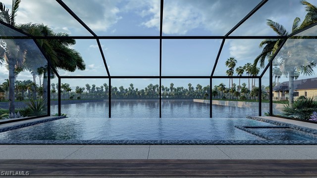 view of pool featuring glass enclosure and a water view