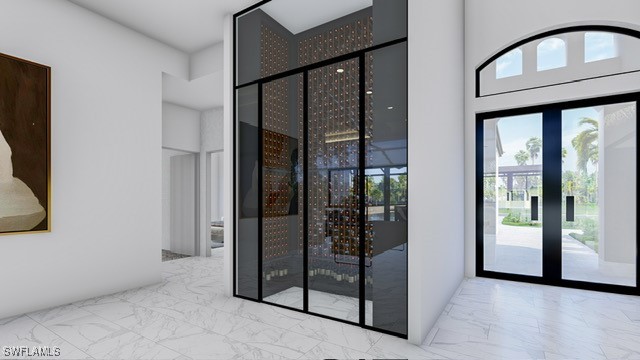 doorway featuring light tile patterned floors and a wealth of natural light