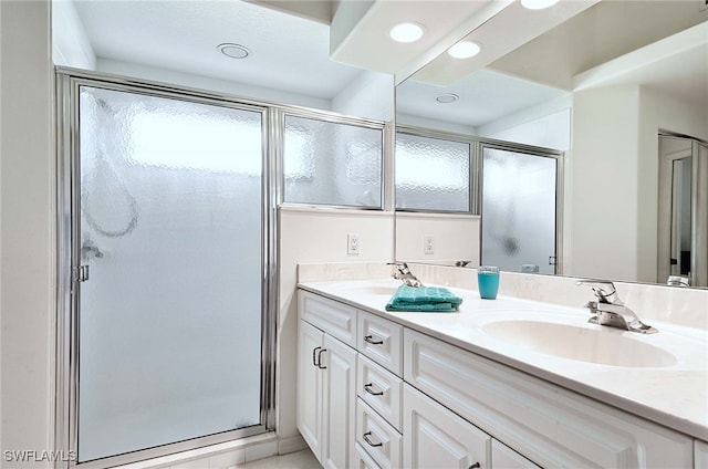 bathroom with vanity and walk in shower