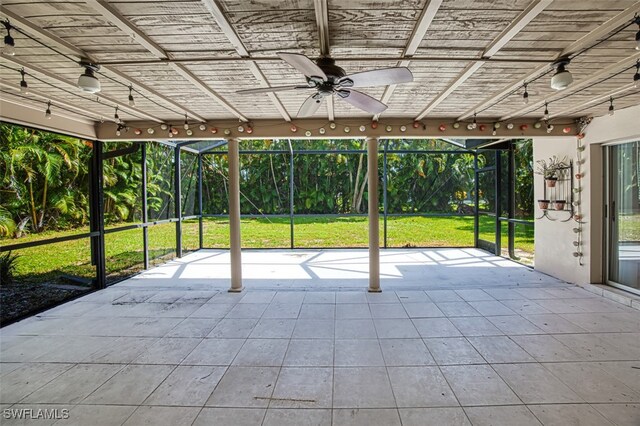 view of patio / terrace with a lanai and ceiling fan