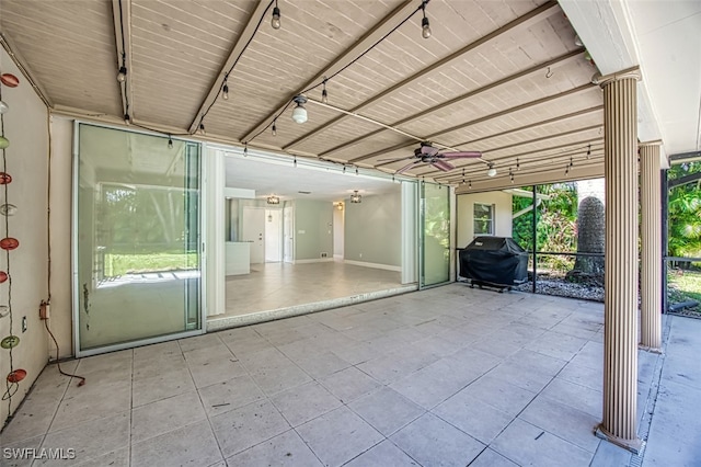 view of patio with ceiling fan and a grill