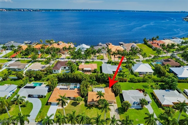 birds eye view of property with a water view