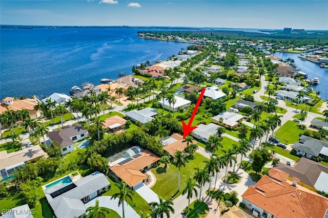 aerial view featuring a water view and a residential view