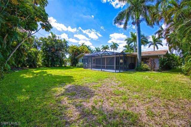 view of yard with a lanai