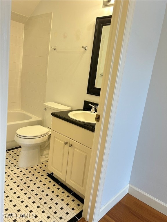 full bathroom with vanity, wood-type flooring, toilet, and tub / shower combination