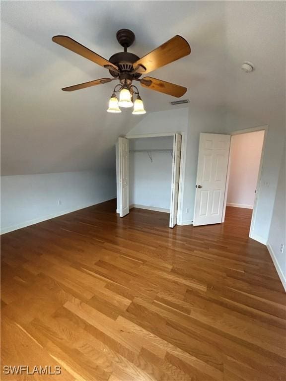 bonus room with baseboards, visible vents, a ceiling fan, wood finished floors, and vaulted ceiling