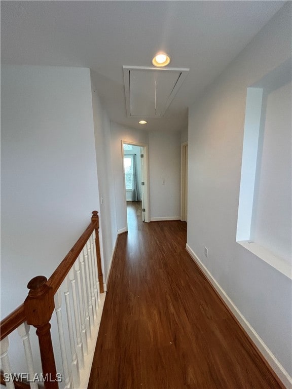 hallway with dark hardwood / wood-style floors