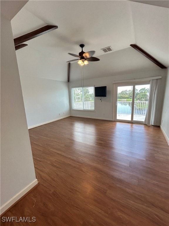 unfurnished room featuring vaulted ceiling with beams, hardwood / wood-style floors, and ceiling fan