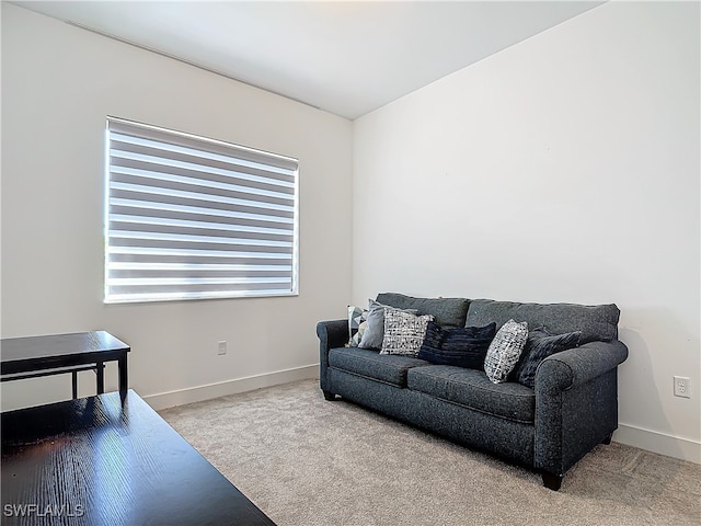 living room with carpet flooring and baseboards