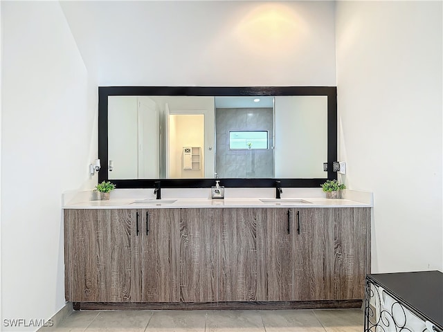 bathroom featuring tile patterned flooring and vanity