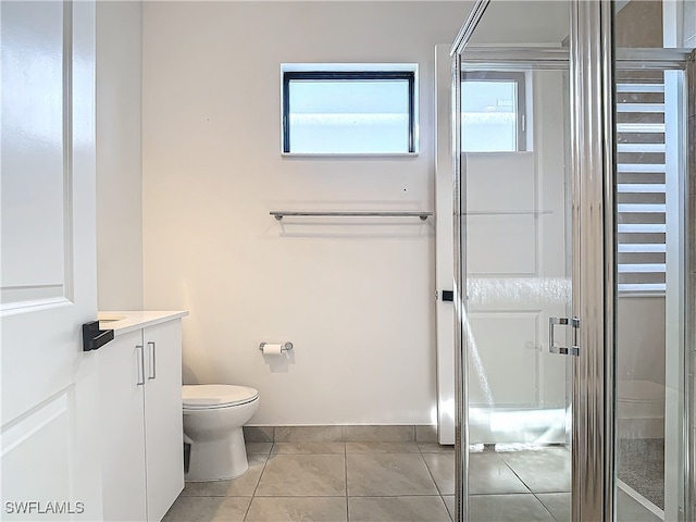 full bathroom with toilet, a stall shower, tile patterned flooring, and vanity