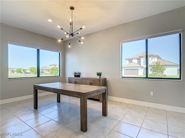 dining room featuring baseboards, recessed lighting, light tile patterned flooring, and an inviting chandelier