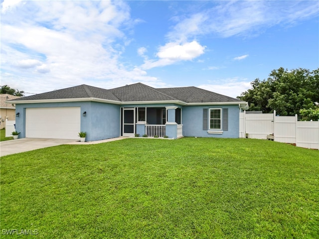 ranch-style house featuring a front yard and a garage