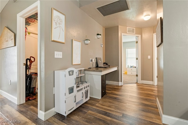 hall with dark hardwood / wood-style flooring