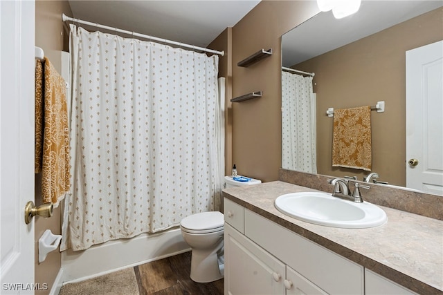 full bathroom with shower / tub combo, vanity, toilet, and hardwood / wood-style floors