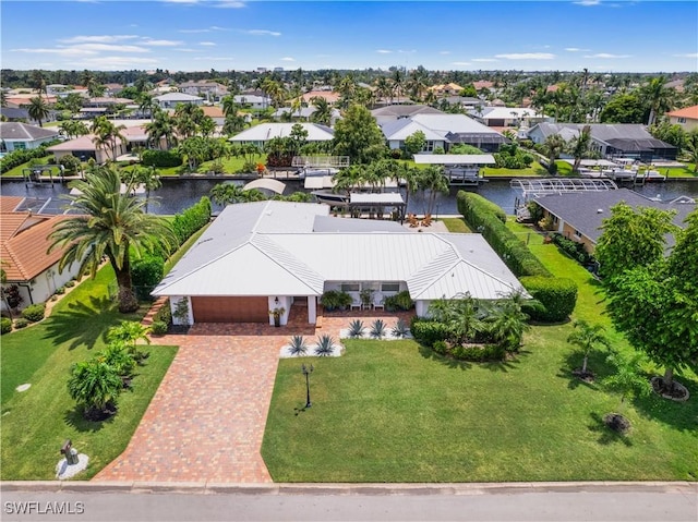 aerial view featuring a residential view and a water view