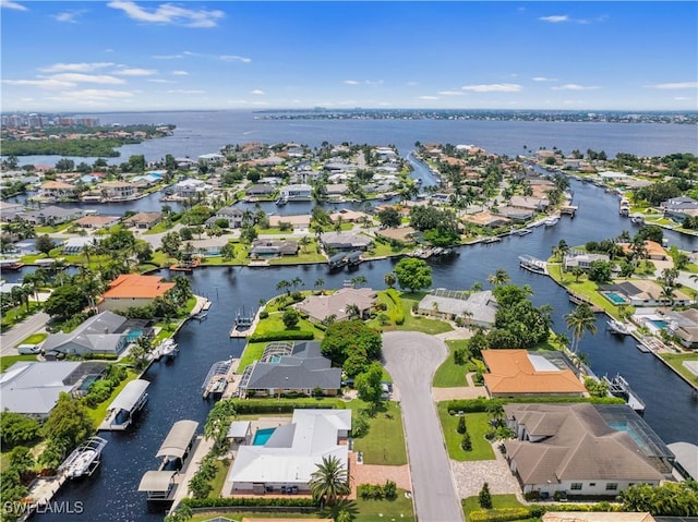 aerial view with a residential view and a water view