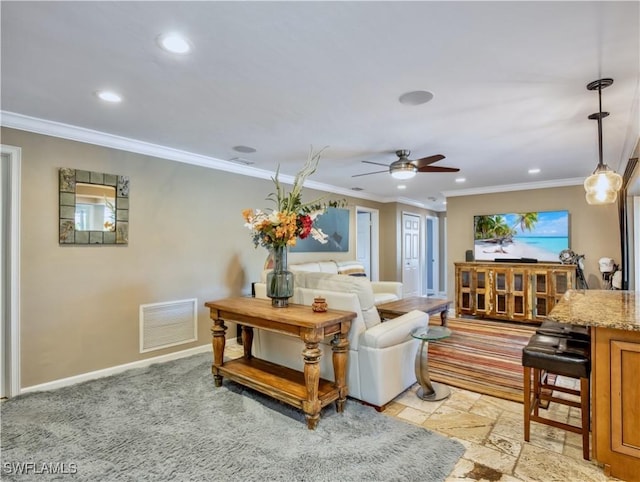 living room with ceiling fan and ornamental molding