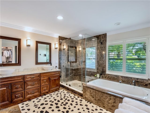 bathroom featuring vanity, tile patterned flooring, ornamental molding, and plus walk in shower