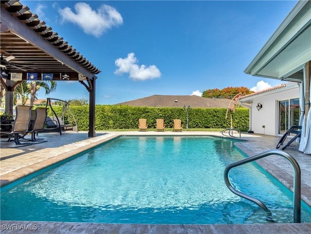 view of swimming pool featuring a patio area