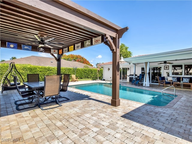 view of swimming pool with a patio and ceiling fan