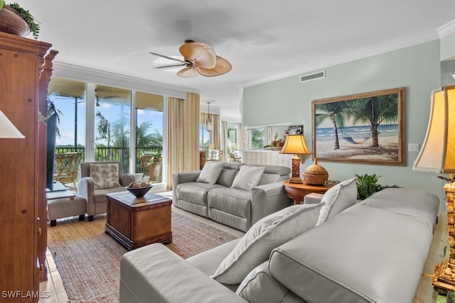 living room featuring crown molding and ceiling fan