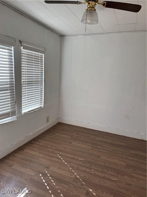 spare room with dark hardwood / wood-style floors