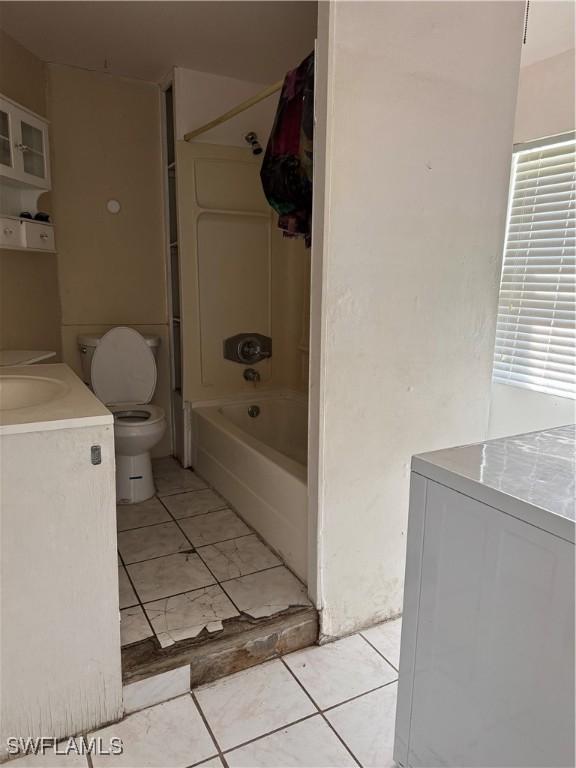 full bathroom with washer and dryer, toilet, shower / bath combination, and vanity